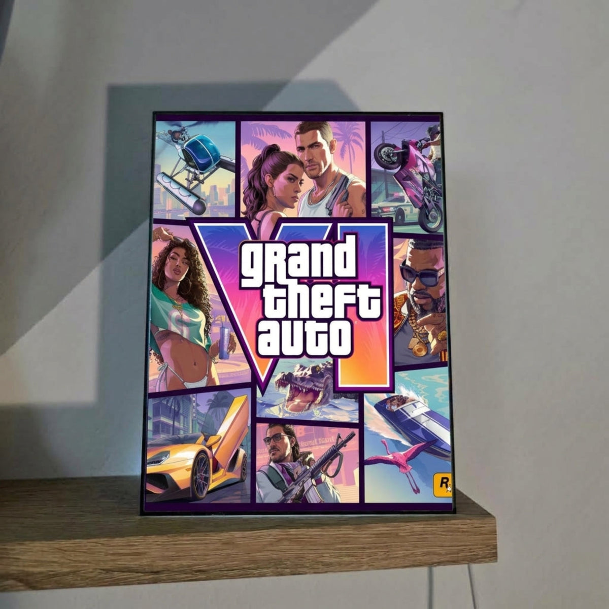 USB powered GTA 6 Collector's Edition art panel (5.9x7.9 inches) displayed on a wooden shelf next to a small plant.
