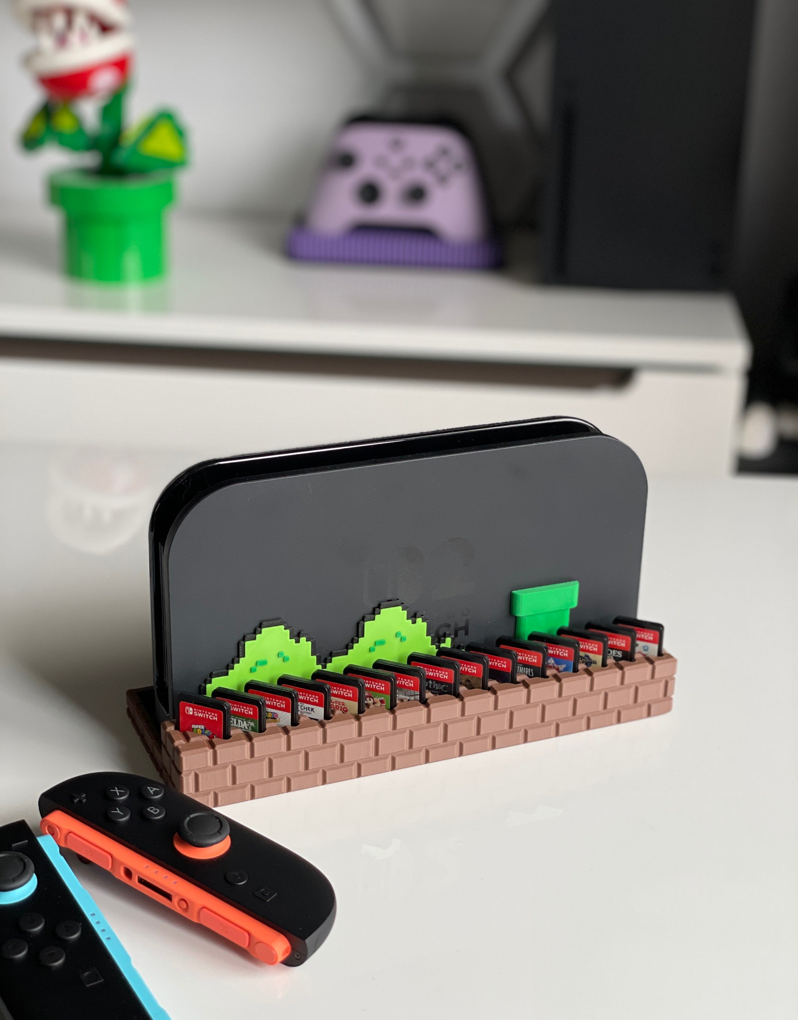 Close-up of Nintendo Switch 2 dock with 15 game cartridge slots – Mario brick design