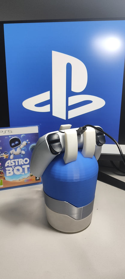 AstroBot gaming accessory holding PS5 controller in a gaming room