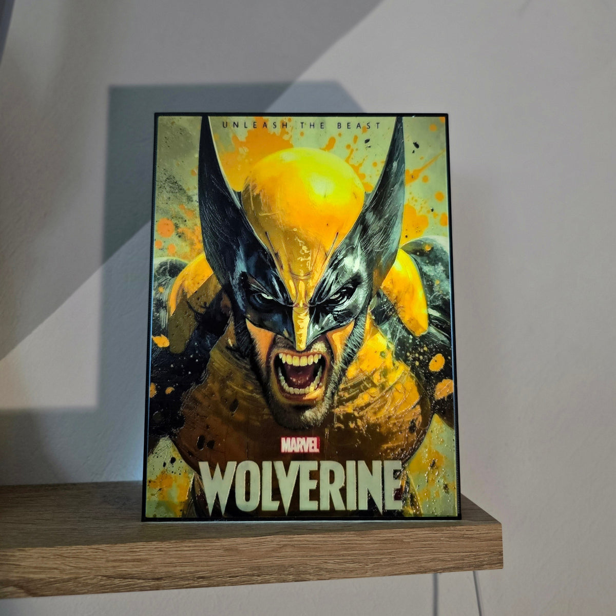 A Marvel Wolverine led light lamp displayed on a wooden shelf against a gray wall.