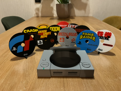 playstation 1 with cd games as a coaster