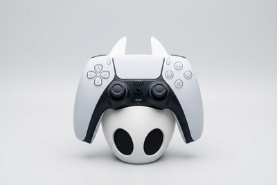 Hornet mask-shaped controller holder with DualSense, front studio visualization