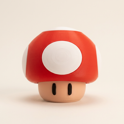 Red and white 3D-printed mushroom LED night light with beige base on an off-white background