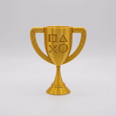 Gold 3D-printed PlayStation-style cup trophy with controller symbols on a light gray background