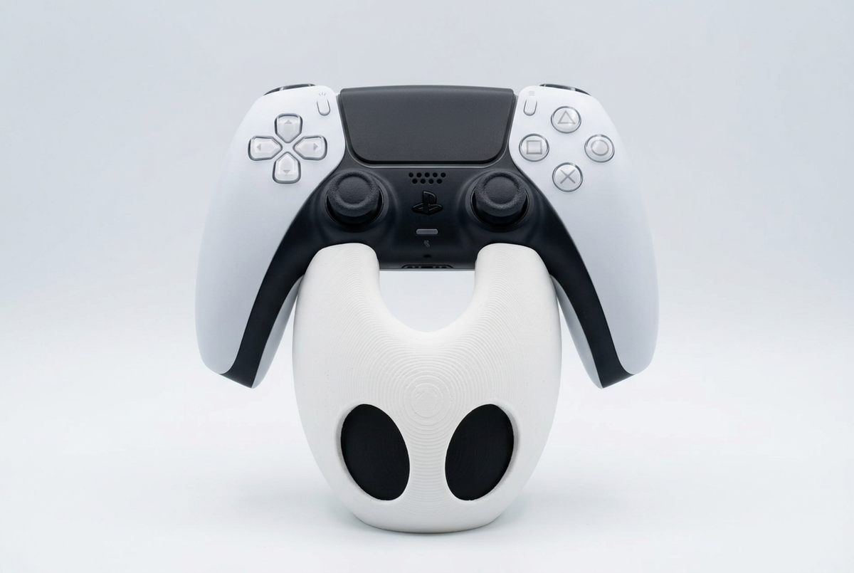 Front view of Silksong Hornet controller stand with DualSense, studio visualization
