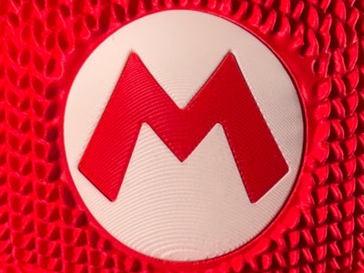 Knitted Super Mario Hat Decor – Mario Cap Gaming Room Decoration – Retro Gamer Gift – Nintendo Inspired Display Piece