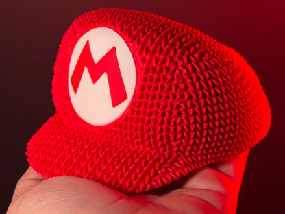 Knitted Super Mario Hat Decor – Mario Cap Gaming Room Decoration – Retro Gamer Gift – Nintendo Inspired Display Piece